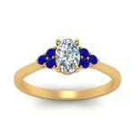Load image into Gallery viewer, petite-cathedral-oval-shaped-diamond-engagement-ring-with-sapphire-in-yellow-gold-FD9275OVRGSABLANGLE5-NL-YG_3d1dce86-7684-4ed8-8112-56aeb6ecbca0?v=1758264077
