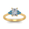 Load image into Gallery viewer, petite-cathedral-radiant-cut-diamond-engagement-ring-with-blue-topaz-in-yellow-gold-FD9275RARGICBLTOANGLE5-NL-YG_b6f5195b-f9bd-4f25-95d1-0596ff1ed00c?v=1758264110