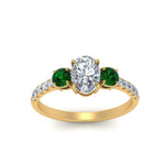 Load image into Gallery viewer, petite-micropave-oval-shaped-three-stone-diamond-engagement-ring-with-emerald-in-yellow-gold-FD9383OVRGEMGR-NL-YG
