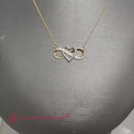Load and play video in Gallery viewer, two-tone-infinity-pendant-necklace-in-14k-yellow-gold-fdpd11206
