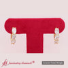 Oval-shaped-huggie-hoops-3-stone-earrings-in-yellow-gold-720 