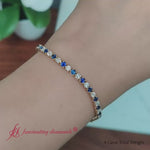 Load and play video in Gallery viewer, tennis-diamond-bracelet-4-carat-with-sapphire-in-18k-yellow-gold-fdbrc8635ro
