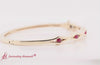 Load and play video in Gallery viewer, three-stone-ruby-bracelet-bangle-for-women-in-yellow-gold-fdbrc310