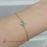 Load and play video in Gallery viewer, chain-four-daimond-stacking-bracelet-with-emerald-in-yellow-gold-FDBRC9628