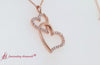 Load and play video in Gallery viewer, double-heart-diamond-pendant-with-pink-sapphire-in-14k-rose-gold-fdpd328