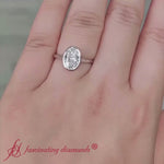 Load and play video in Gallery viewer, Split Shank Oval Shaped Bezel Set Solitaire Ring
