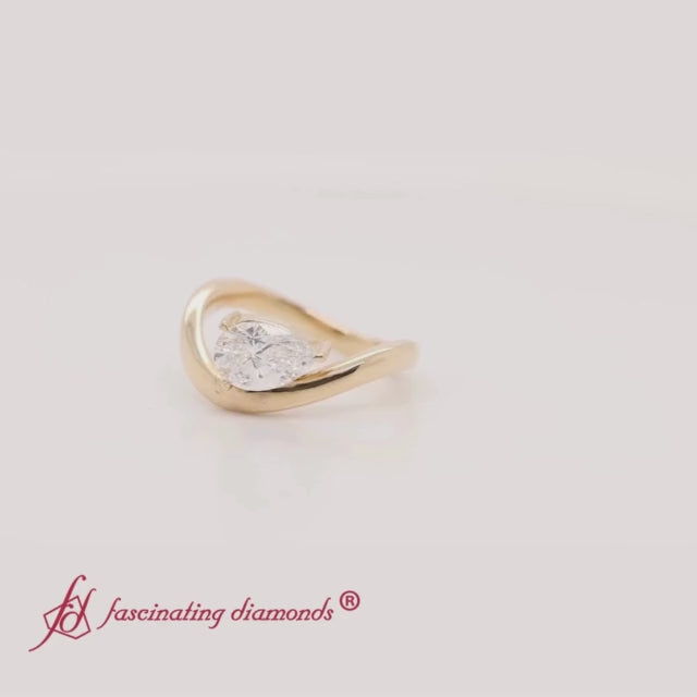 curve-wave-pear-shaped-solitaire-diamond-ring-in-yellow-gold-fdens11566R-2