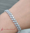 Load and play video in Gallery viewer, pear-shaped-petal-style-diamond-bracelet-in-white-gold-fdbr8150