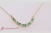 Load and play video in Gallery viewer, 1-carat-diamond-graduated-smile-necklace-with-emerald-in-yellow-gold-fdpd9195-video