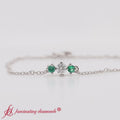 Thumbnail 56 - 3-stone-bracelet-for-mothers-with-emerald-in-white-gold-FDBRC8693-video