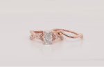 Load and play video in Gallery viewer, Radiant Cut Daisy Twisted Wedding Ring Set
