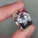 Load and play video in Gallery viewer, his-and-her-diamond-matching-wedding-band-with-sapphire-in-18k-white-gold-fd1144b