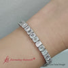 Load and play video in Gallery viewer, tennis-bracelet-basket-set-emerald-cut-20-carat-in-14k-white-gold-fdbrc10449em-20.00ct