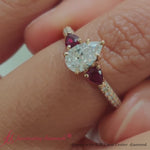 Load and play video in Gallery viewer, ruby-pear-accented-3-row-pear-shaped-engagement-ring-in-14k-yellow-gold-fdenr9982-video1-nl-yg
