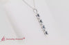 Load and play video in Gallery viewer, vertical-bar-necklace-seven-princess-cut-diamond-with-sapphire-in-white-gold-fdpd8416-video1