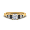 Load image into Gallery viewer, princess-cut-channel-three-stone-diamond-engagement-ring-with-black-diamond-in-yellow-gold-FDENS205PRRGBLACK-NL-YG.jpg