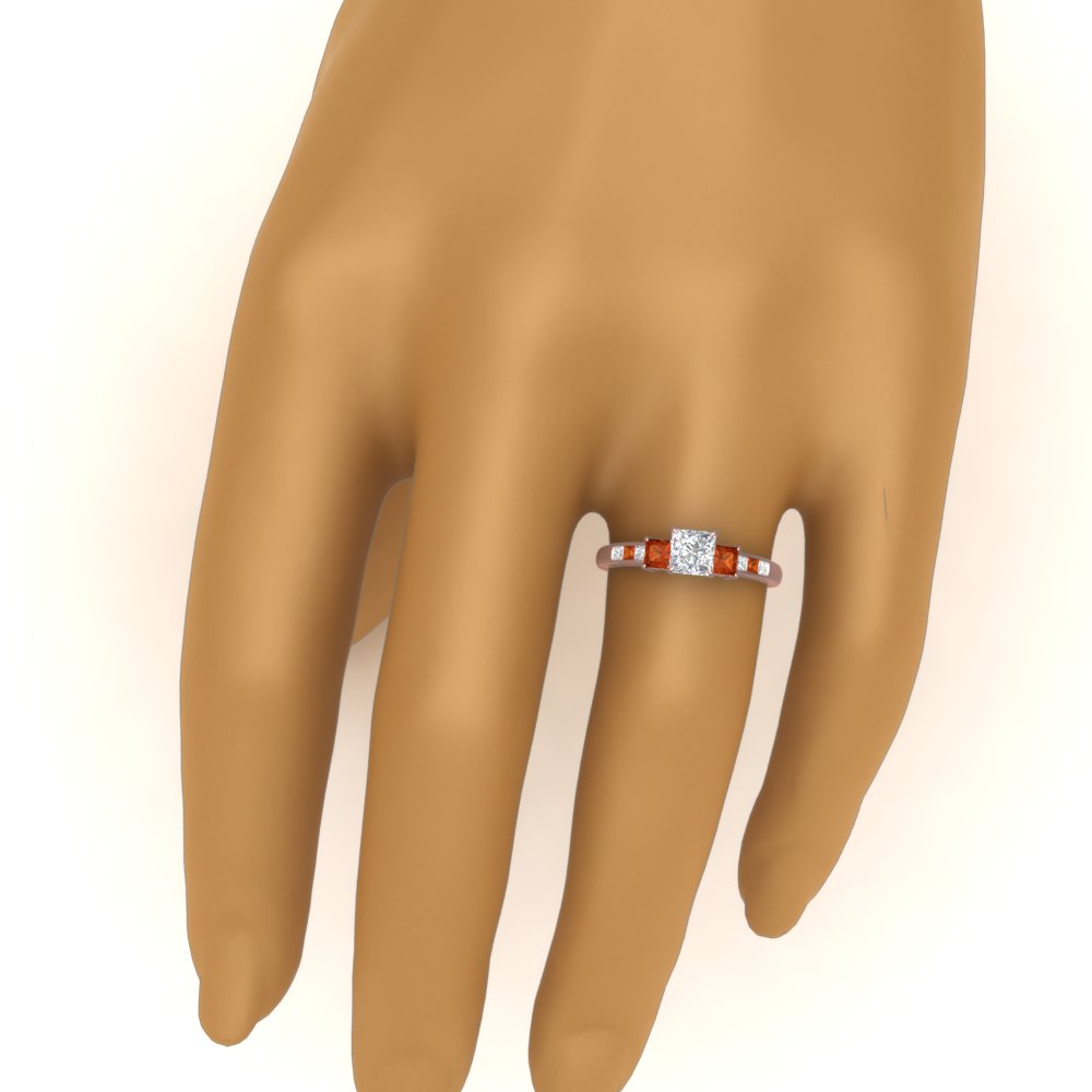 princess-cut-channel-three-stone-diamond-engagement-ring-with-orange-sapphire-in-rose-gold-FDENS205PRRGSAOR-NL-RG.jpg