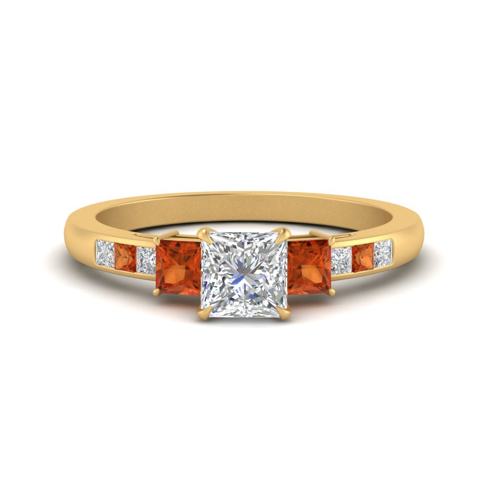 princess-cut-channel-three-stone-diamond-engagement-ring-with-orange-sapphire-in-yellow-gold-FDENS205PRRGSAOR-NL-YG.jpg