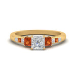 Load image into Gallery viewer, princess-cut-channel-three-stone-diamond-engagement-ring-with-orange-sapphire-in-yellow-gold-FDENS205PRRGSAOR-NL-YG.jpg
