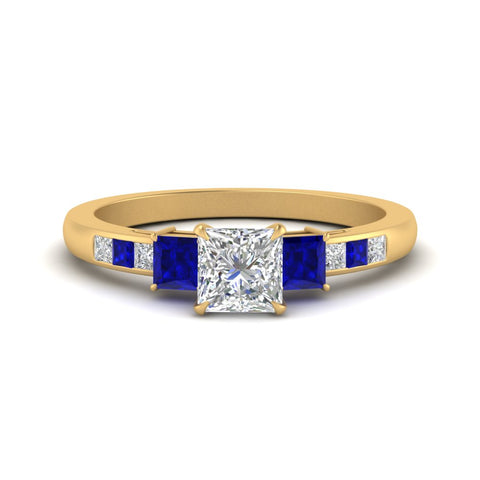 princess-cut-channel-three-stone-diamond-engagement-ring-with-sapphire-in-yellow-gold-FDENS205PRRGSABL-NL-YG.jpg