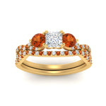 Load image into Gallery viewer, princess-cut-twisted-floral-prong-orange-sapphire-wedding-set-in-yellow-gold-FD10257PRGSAOR-ANGLE5-NL-YG_74d2ab98-67bb-4666-847d-c5680b7d8044?v=1756360168
