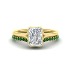 Load image into Gallery viewer, radiant-cut-bezel-solitaire-ring-with-emerald-band-in-yellow-gold-FD11229RAGEMGR-NL-YG.jpg?v=1758702888