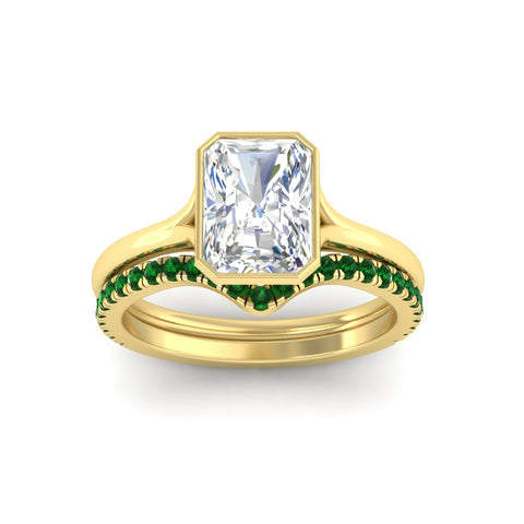 radiant-cut-bezel-solitaire-ring-with-emerald-band-in-yellow-gold-FD11229RAGEMGRANGLE5-NL-YG_89e76987-d3ce-48a1-9e7d-01d2fa08c65e.jpg?v=1758702954