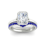 Load image into Gallery viewer, radiant-cut-bezel-solitaire-ring-with-sapphire-band-in-white-gold-FD11229RAGSABLANGLE5-NL-WG_0c16f149-9cd4-4cca-b573-0ffb71326711.jpg?v=1758702954