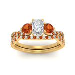 Load image into Gallery viewer, radiant-cut-twisted-floral-prong-orange-sapphire-wedding-set-in-yellow-gold-FD10257RAGSAOR-ANGLE5-NL-YG_41de63d4-8881-45e5-a622-7cf1d018f8de?v=1756360178
