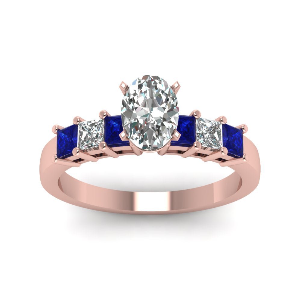 rose-gold-oval-white-diamond-engagement-wedding-ring-with-blue-sapphire-in-prong-set-FDENS1027OVRGSABLANGLE5-NL-RG_1e07bb6c-81c8-4673-aa3c-3e17376d89a9