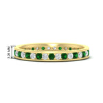 Load image into Gallery viewer, round-channel-set-eternity-band-with-emerald-in-yellow-gold-fdewb158gemgrsleep-nl-yg-hw
