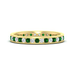 Load image into Gallery viewer, round-channel-set-eternity-band-with-emerald-in-yellow-gold-fdewb158gemgrsleep-nl-yg
