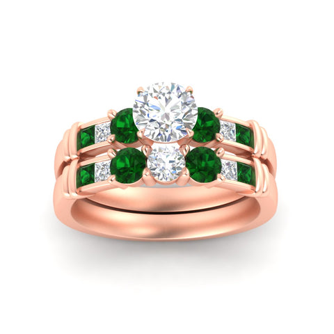 round-cut-bridal-ring-set-with-emerald-princess-channel-accents-in-rose-gold-fdens286rogemgrangle5-nl-rg.jpg