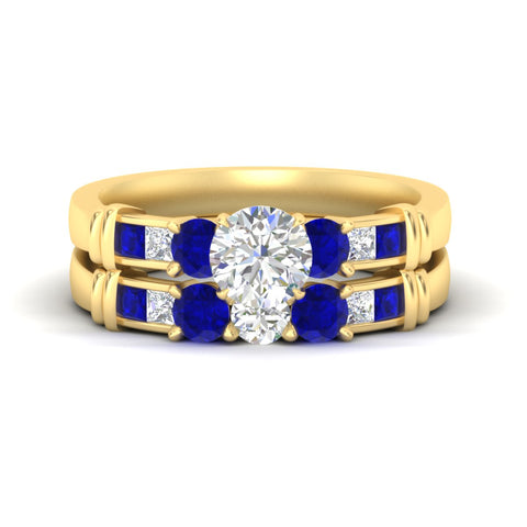 round-cut-bridal-ring-set-with-sapphire-princess-channel-accents-in-yellow-gold-fdens286rogsablsleep-nl-yg.jpg