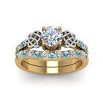 Load image into Gallery viewer, round-cut-celtic-diamond-wedding-ring-set-with-blue-topaz-in-14K-yellow-gold-FDENS2255B1ROGICBLTOANGLE5-NL-YG_95e32ad0-f673-4b02-bf5b-d8852a47b4cf?v=1757057012
