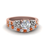 Load image into Gallery viewer, round-cut-celtic-diamond-wedding-ring-set-with-orange-sapphire-in-14K-rose-gold-FDENS2255B1ROGSAOR-NL-RG_f875996c-297c-476b-8f82-5bea52b4ed48?v=1757057012
