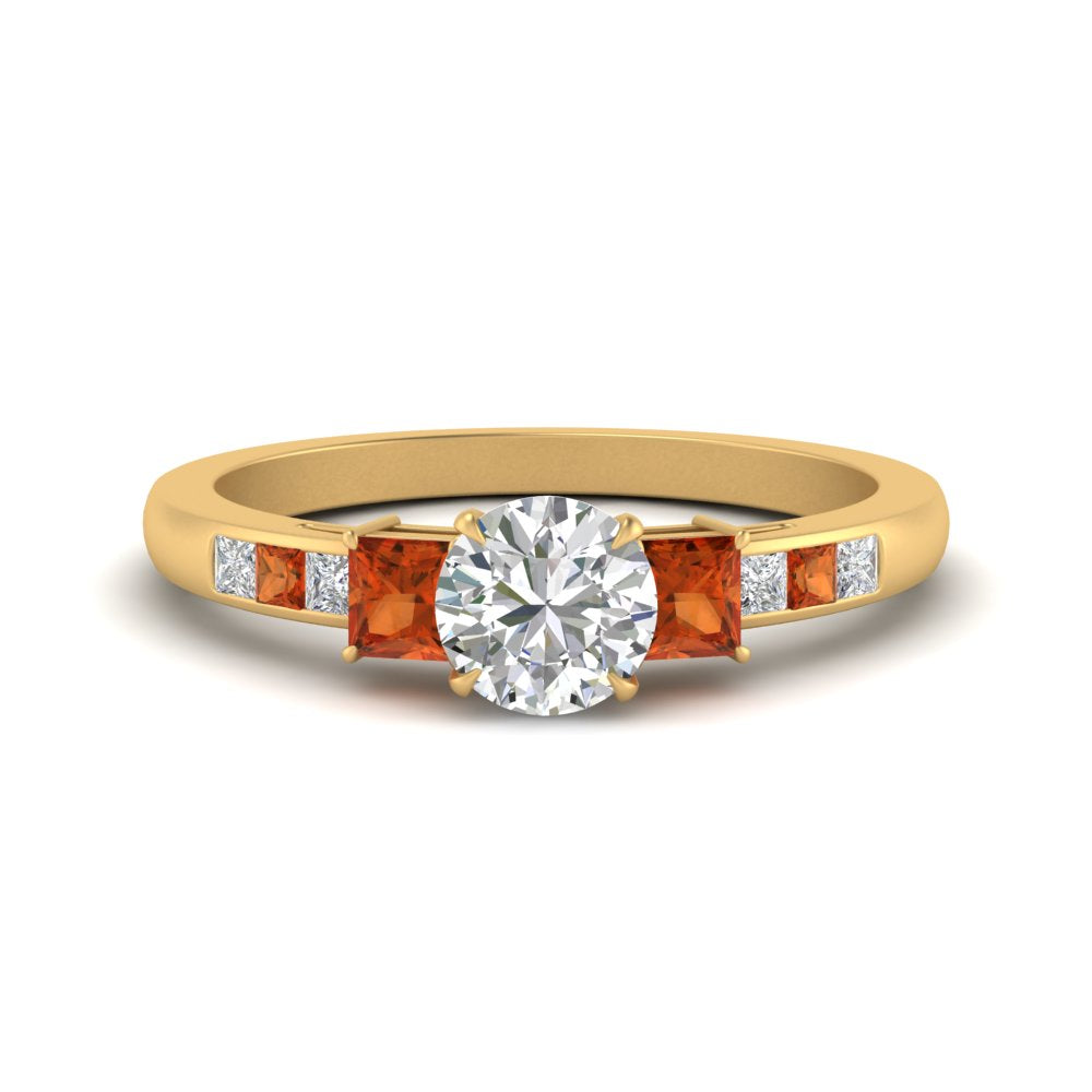 round-cut-channel-three-stone-diamond-engagement-ring-with-orange-sapphire-in-yellow-gold-FDENS205RORGSAOR-NL-YG.jpg