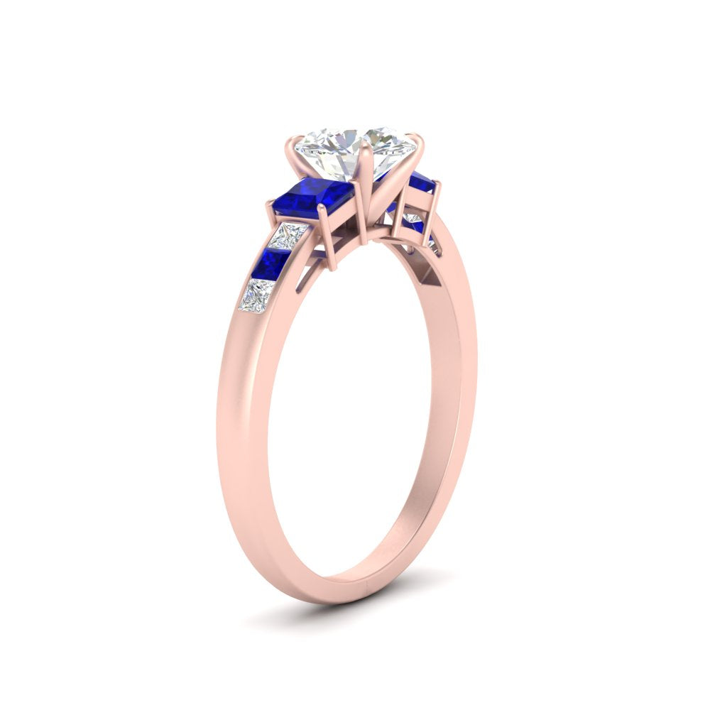 round-cut-channel-three-stone-diamond-engagement-ring-with-sapphire-in-rose-gold-FDENS205RORGSABL-NL-RG.jpg