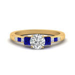 Load image into Gallery viewer, round-cut-channel-three-stone-diamond-engagement-ring-with-sapphire-in-yellow-gold-FDENS205RORGSABL-NL-YG.jpg
