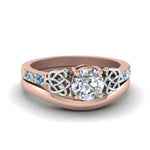 Load image into Gallery viewer, round-cut-diamond-celtic-wedding-set-with-blue-topaz-in-14K-rose-gold-FDENS2255B3ROGICBLTO-NL-RG_409589a2-ff88-4939-b7ec-b32b06c5e3d7?v=1756976865
