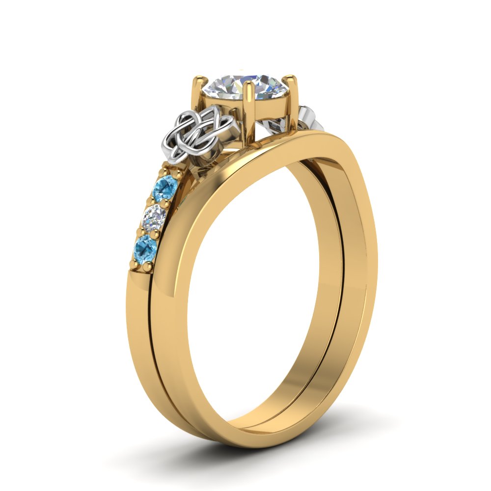 round-cut-diamond-celtic-wedding-set-with-blue-topaz-in-14K-yellow-gold-FDENS2255B3ROGICBLTOANGLE2-NL-YG_4c06a12a-8db1-4f42-882a-770c70e79010?v=1756976865