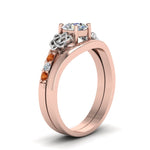 Load image into Gallery viewer, round-cut-diamond-celtic-wedding-set-with-orange-sapphire-in-14K-rose-gold-FDENS2255B3ROGSAORANGLE2-NL-RG_4f06213c-8828-4841-a3a3-47793fc8a1dc?v=1756976864
