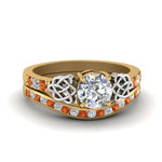 Load image into Gallery viewer, round-cut-diamond-channel-band-celtic-bridal-set-with-orange-sapphire-in-14K-yellow-gold-FDENS2255B2ROGSAOR-NL-YG_8d351789-1d5b-4632-9ab2-d0df28b972cf?v=1756980511
