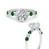 Load image into Gallery viewer, round-cut-prong-studded-emerald-accented-solitaire-engagement-ring-in-FD10955RORGEMGRANGLE3-NL-WG