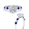 Load image into Gallery viewer, round-cut-prong-studded-sapphire-accented-solitaire-engagement-ring-in-FD10955RORGSABLANGLE3-NL-WG