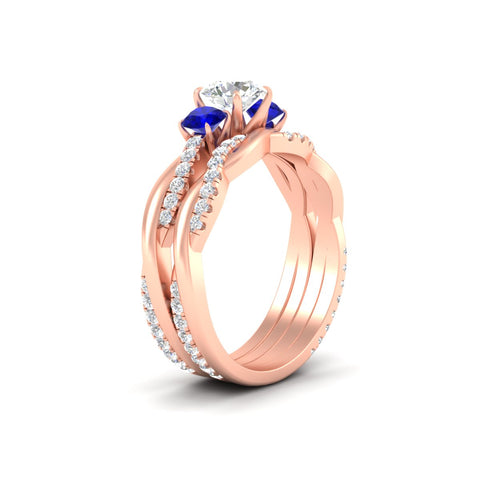 round-cut-three-stone-twisted-sapphire-wedding-band-in-rose-gold-fdens3301rogsablangle2-nl-rg.jpg