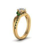 Load image into Gallery viewer, round-cut-twisted-diamond-bridal-set-with-emerald-in-14K-yellow-gold-FD8300ROGEMGR-NL-YG.jpg
