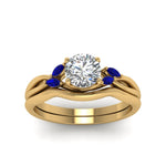 Load image into Gallery viewer, round-cut-twisted-diamond-ring-with-matching-curved-band-with-blue-sapphire-in-14K-yellow-gold-FD8300ROGSABL-NL-YG.jpg
