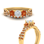 Load image into Gallery viewer, round-cut-twisted-floral-prong-orange-sapphire-wedding-set-in-yellow-gold-FD10257ROGSAOR-ANGLE3-NL-YG?v=1756360082

