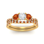 Load image into Gallery viewer, round-cut-twisted-floral-prong-orange-sapphire-wedding-set-in-yellow-gold-FD10257ROGSAOR-ANGLE5-NL-YG_caea5e0d-9bb3-46be-b3cc-eced52a0db8c?v=1756360189
